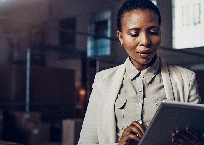 Female with a tablet in her hand