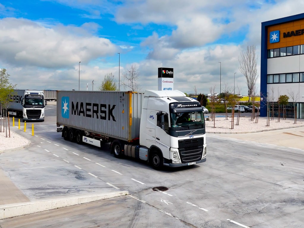 A Maersk truck departs a logistics hub.
