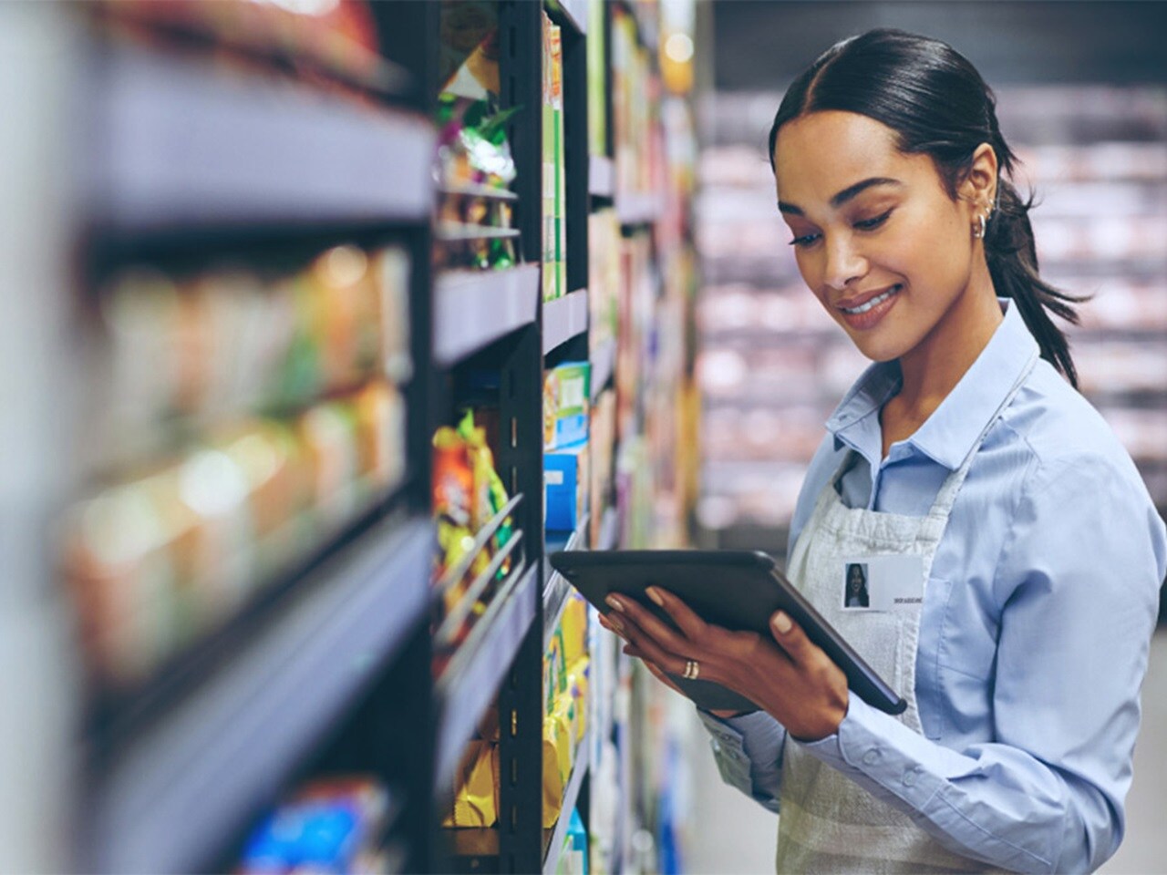 Female looking at tablet in a store