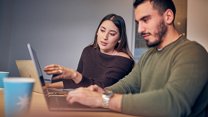 Male and Female employees are discussing about a project