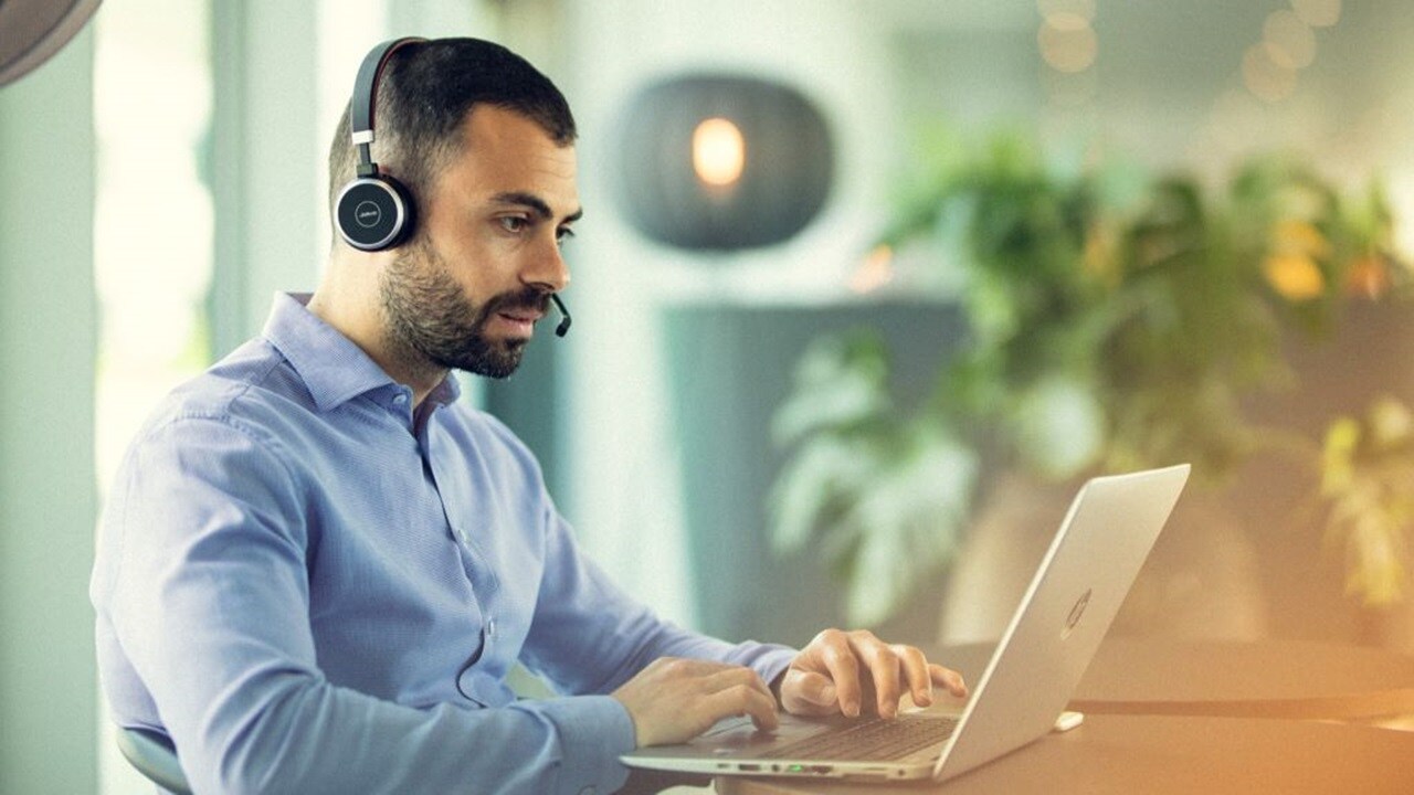 Employee working and wearing headphones