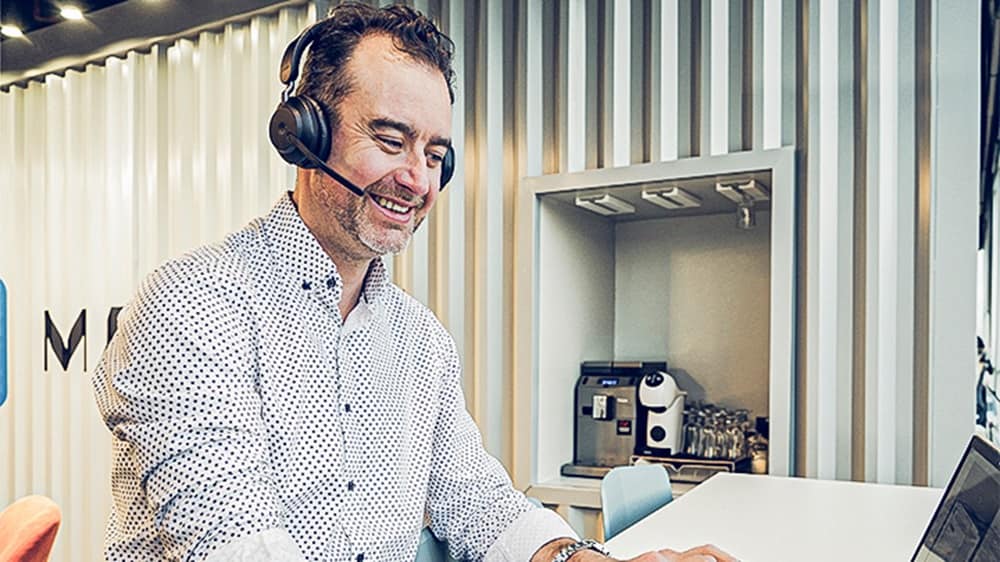 Employee working waring headphones