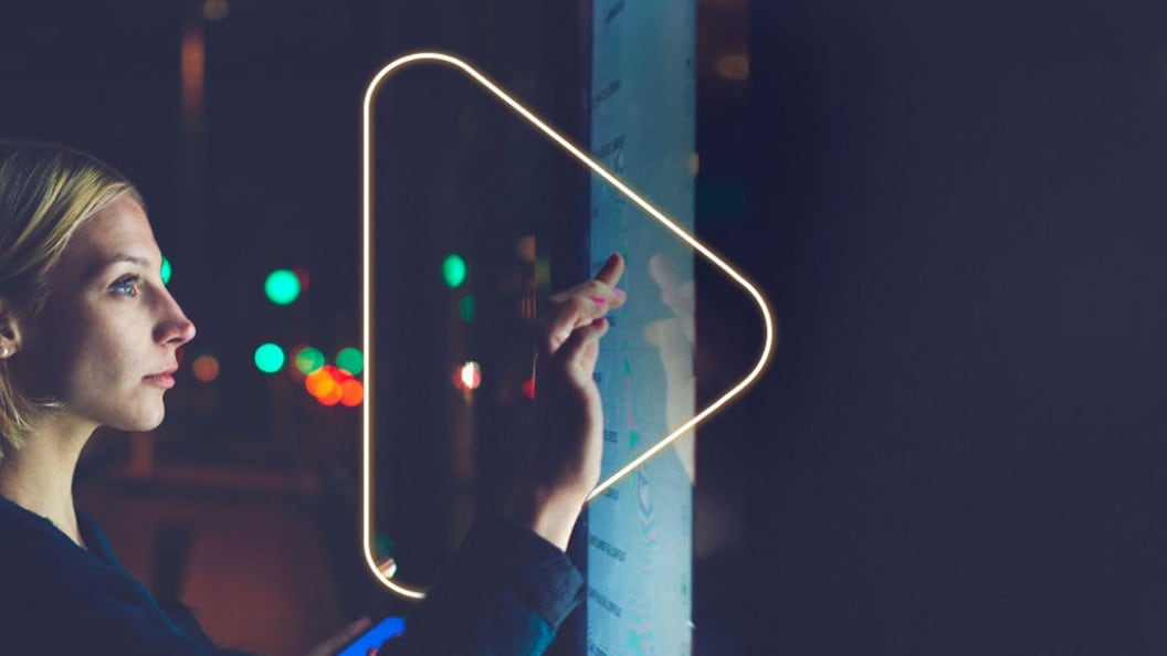 Women touching LED screen