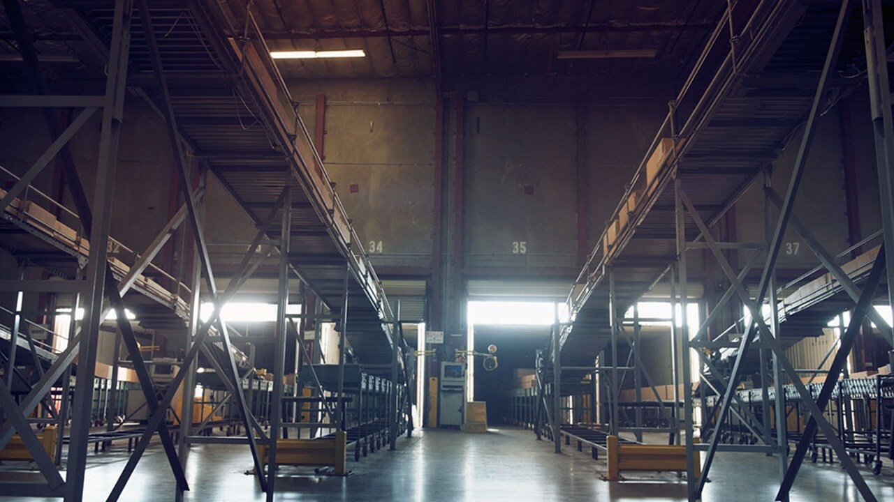 Warehouse shelves stacked with packages