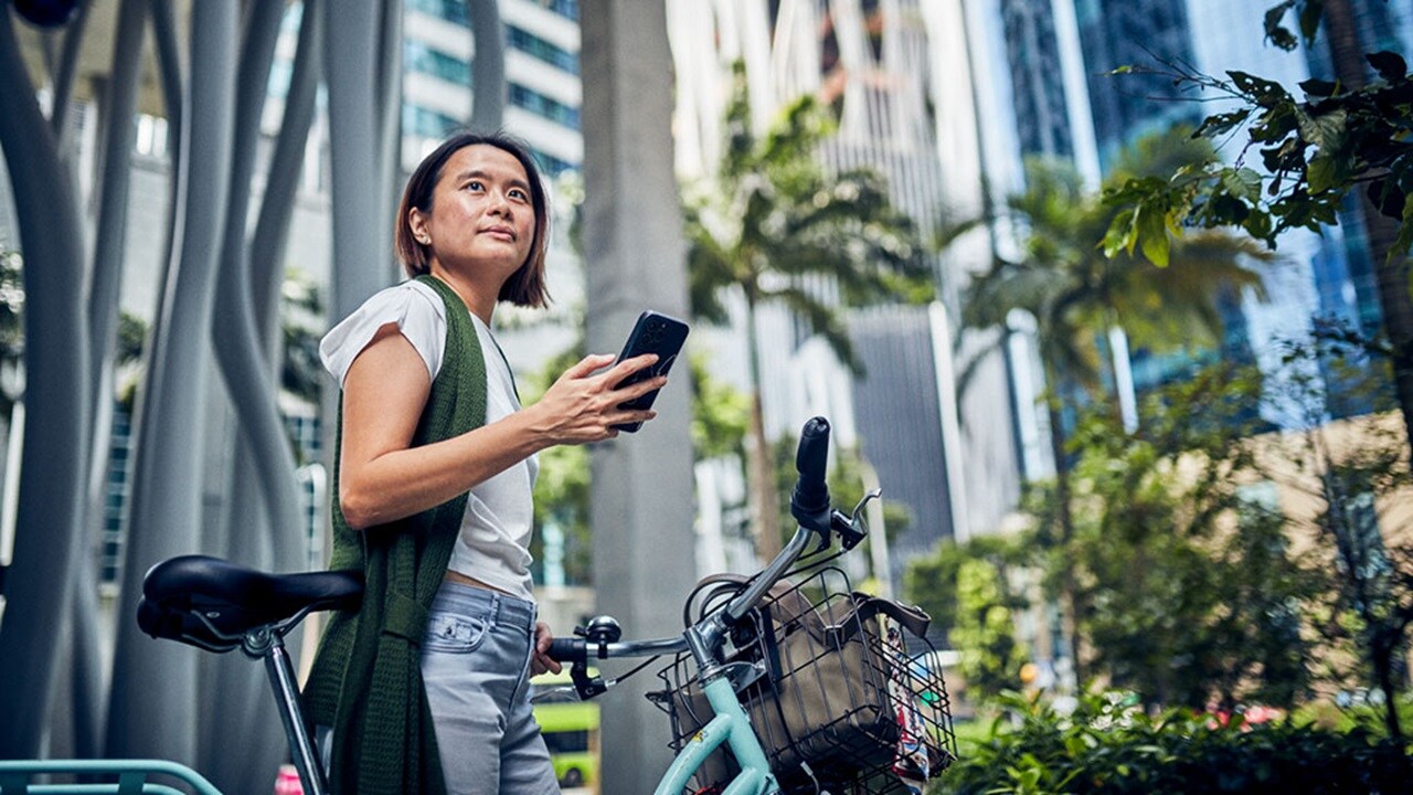 Lady with cycle and phone