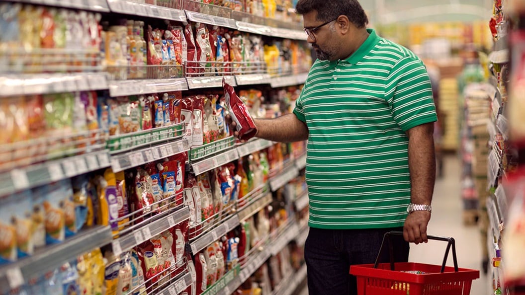 man at a store browsing product options
