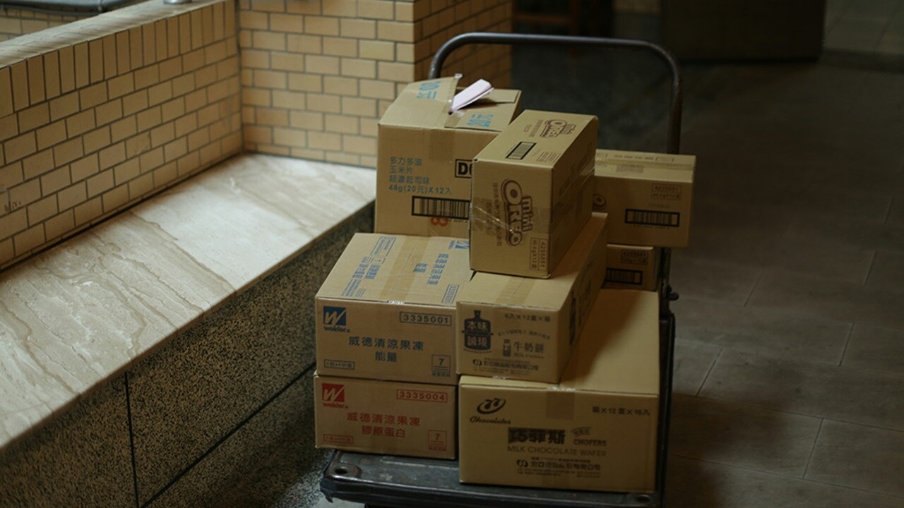 Brown cardboard boxes on gray metal rack