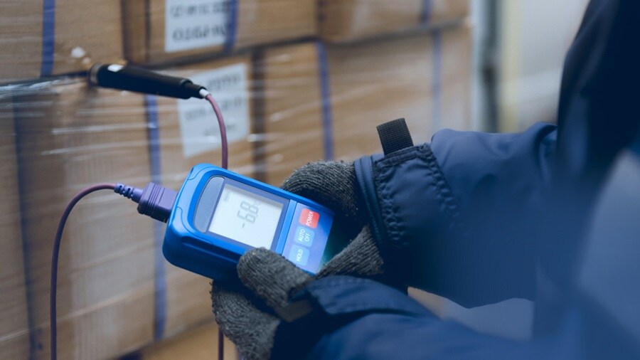 Close up shot a set of hands holding a technical tool