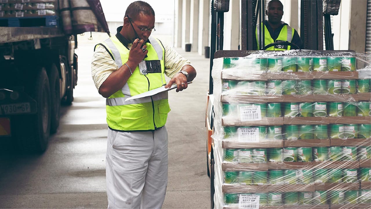 Two individuals in a loading dock area