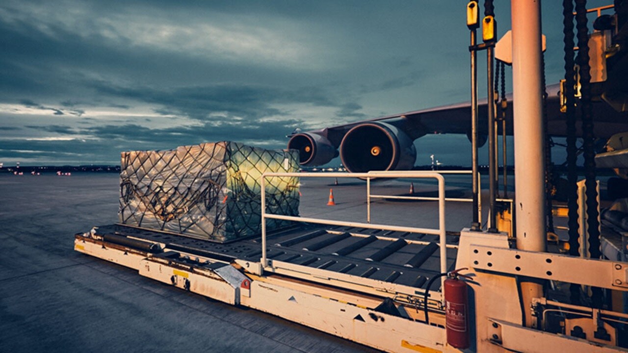 Cargo is being loaded onto an airplane