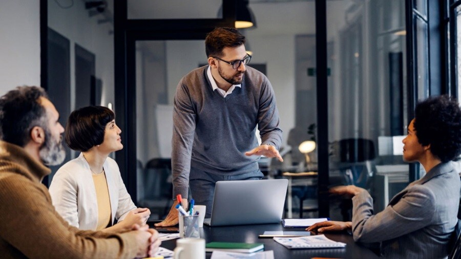 A group of people discussing in a meeting room.