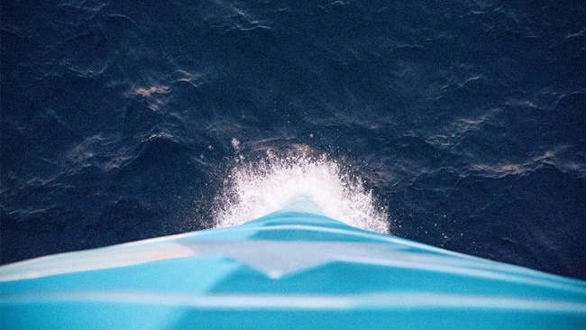 The front of a container vessel, representing ocean shipping and navigating disruption.
