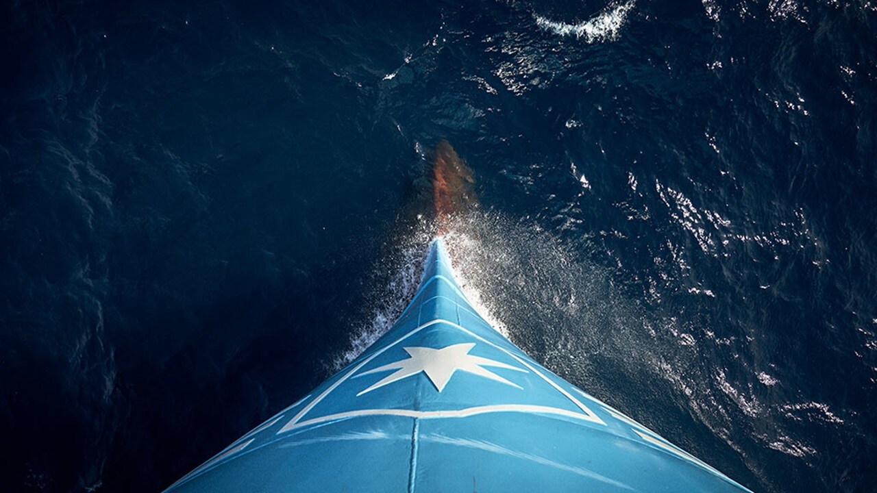 Maersk vessel sailing in the ocean.