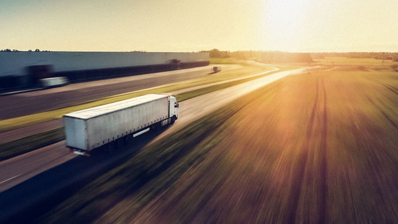 truck driving to deliver sustainable goods 