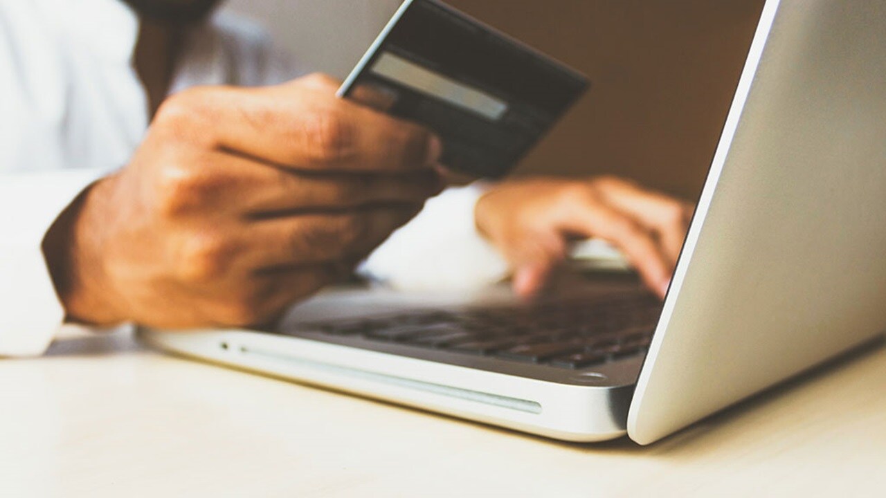 Someone makes an online purchase on their laptop using a credit card