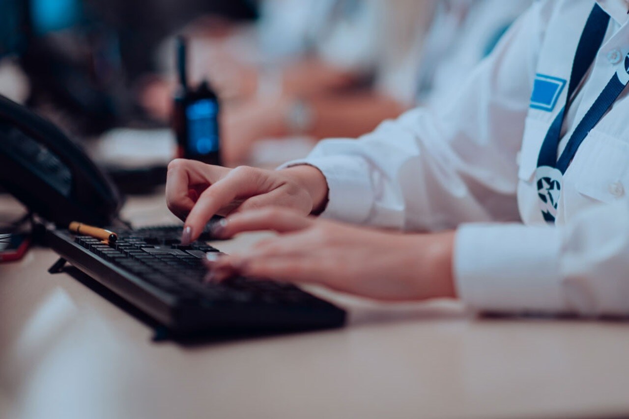 A set of hands working on a keyboard