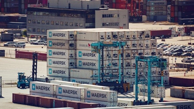 Stacked Maersk containers at port