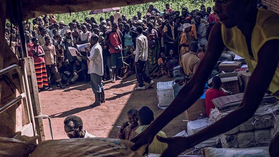 A group of people assembled at the emergency cargo centre in a remote location in Chad.