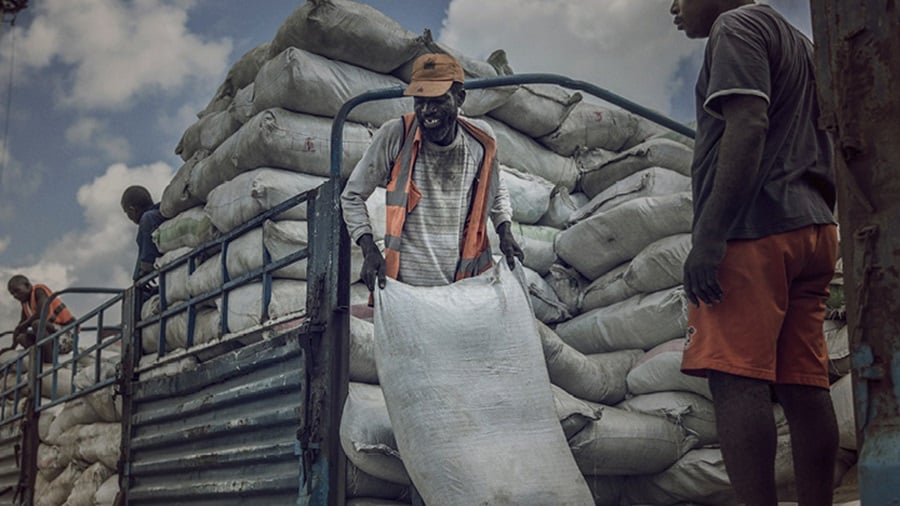 Cargo transportation - Men unloading a truck containing emergency cargo in Africa.