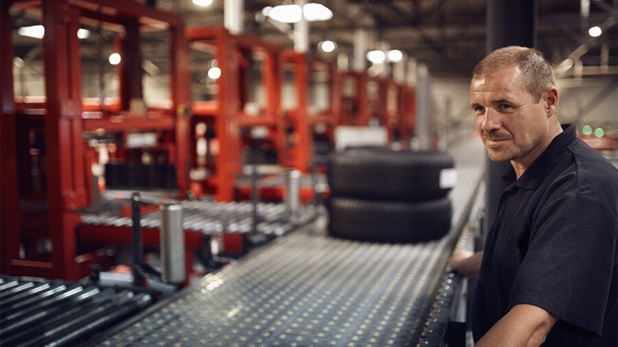 Person working in manufacturing of vehicles