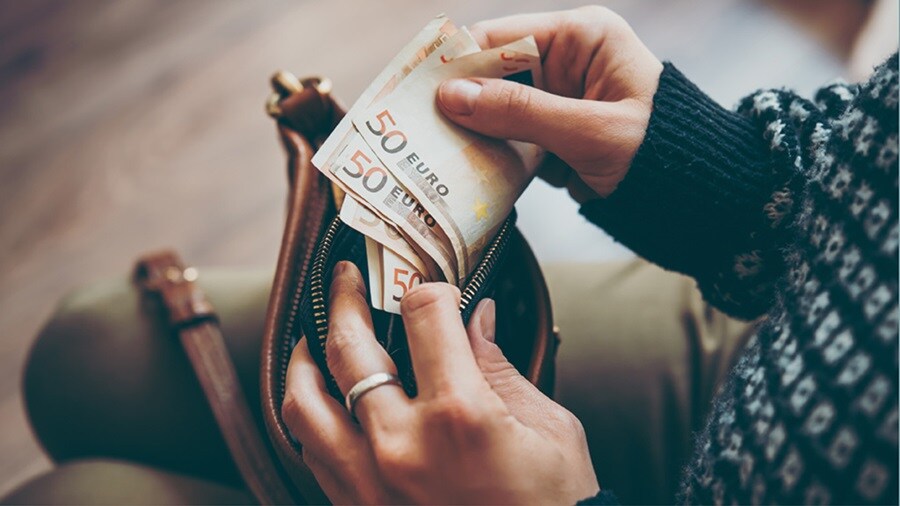 Woman holding Euro currency notes