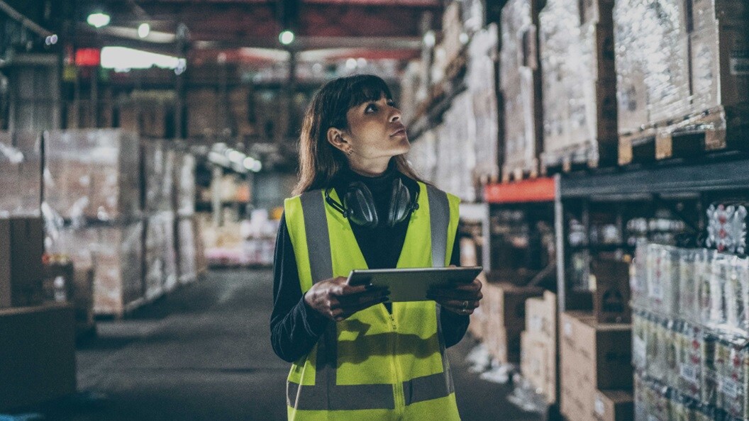 Female in a warehouse looking at the shipments