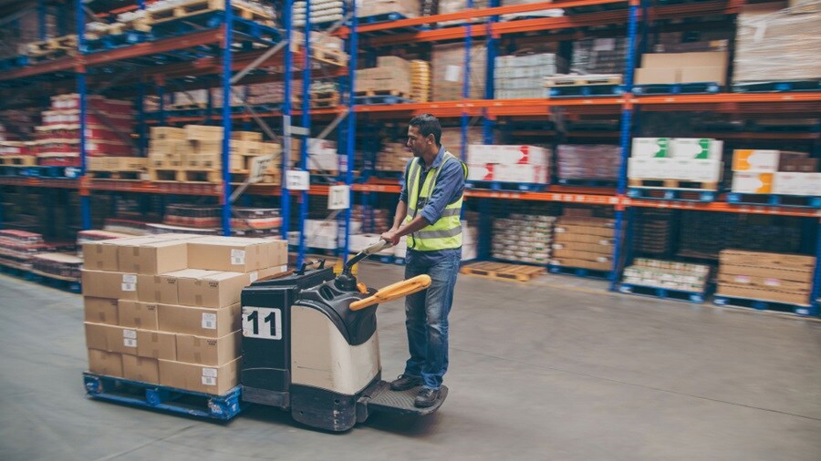 Male moving shipments on a trolley