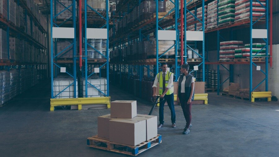 Two male working in a warehouse