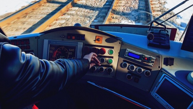 Close up shot of a hand in the cockpit of a plane