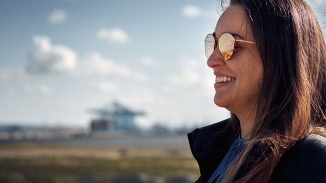 A?woman smiles, representing the news that Maersk has been recognised as a Leader in the 2024 Gartner® Magic Quadrant? for Third-party Logistics for the third year in a row 