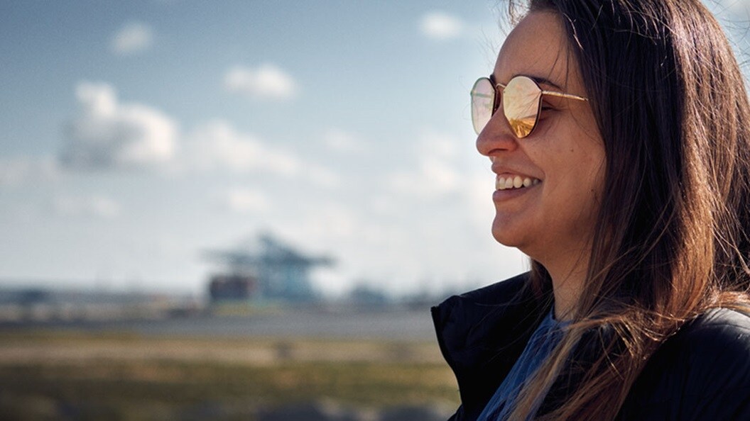 A?woman smiles, representing the news that Maersk has been recognised as a Leader in the 2024 Gartner® Magic Quadrant? for Third-party Logistics for the third year in a row 