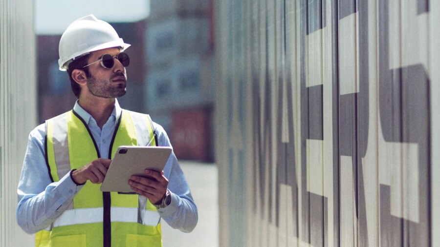 Man holding tab looking up