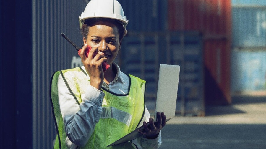 Woman holding walkie talkie