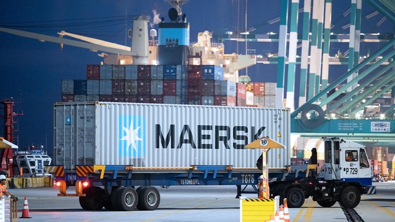 Maersk container on trailer at busy port