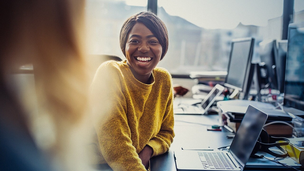 Woman in office working on laptop