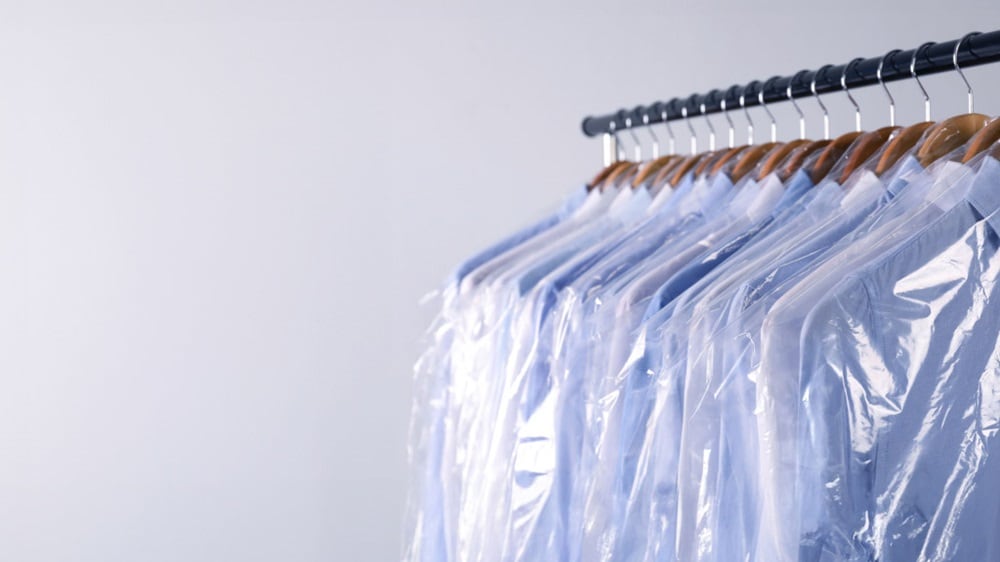 A bunch of shirts hanged on a rack