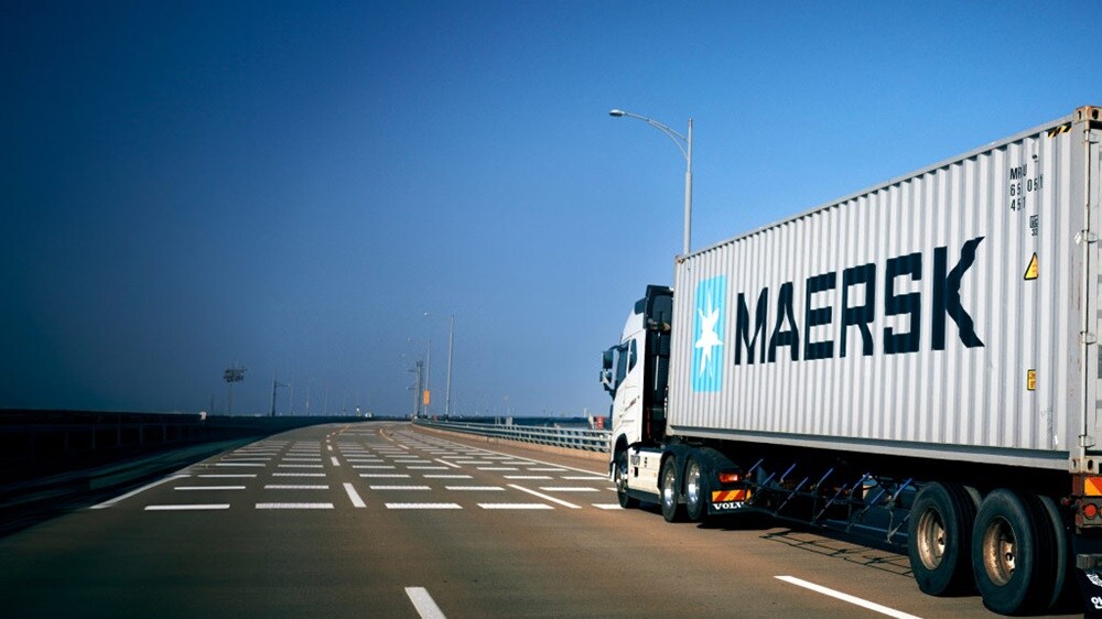 Image of a truck with a Maersk premium quality container with an extra layer of protection for safeguarding goods.