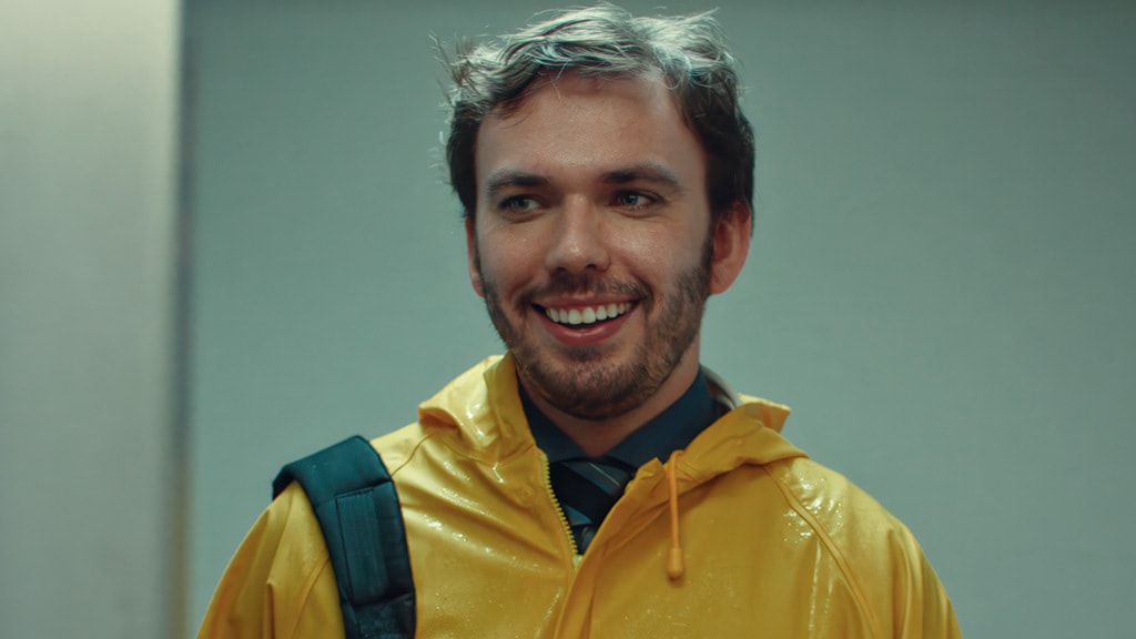 A cheerful man in a yellow raincoat symbolizes readiness and resilience in the face of logistics challenges.